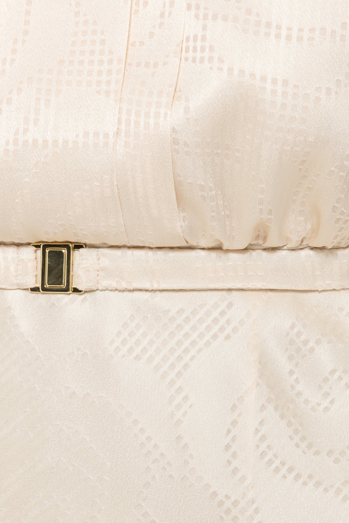 Slim cream waist belt with a rectangular gold-tone buckle on NISSA patterned satin midi dress.