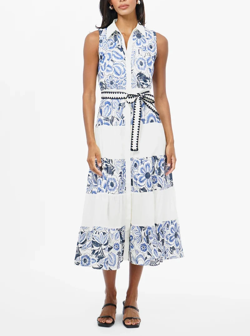 woman wearing embroidered sleeveless blue and white collared midi dress for vacation