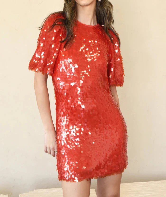 Front view of red paillette sequin mini dress with short puff sleeves, crew neckline and bodycon shift silhouette