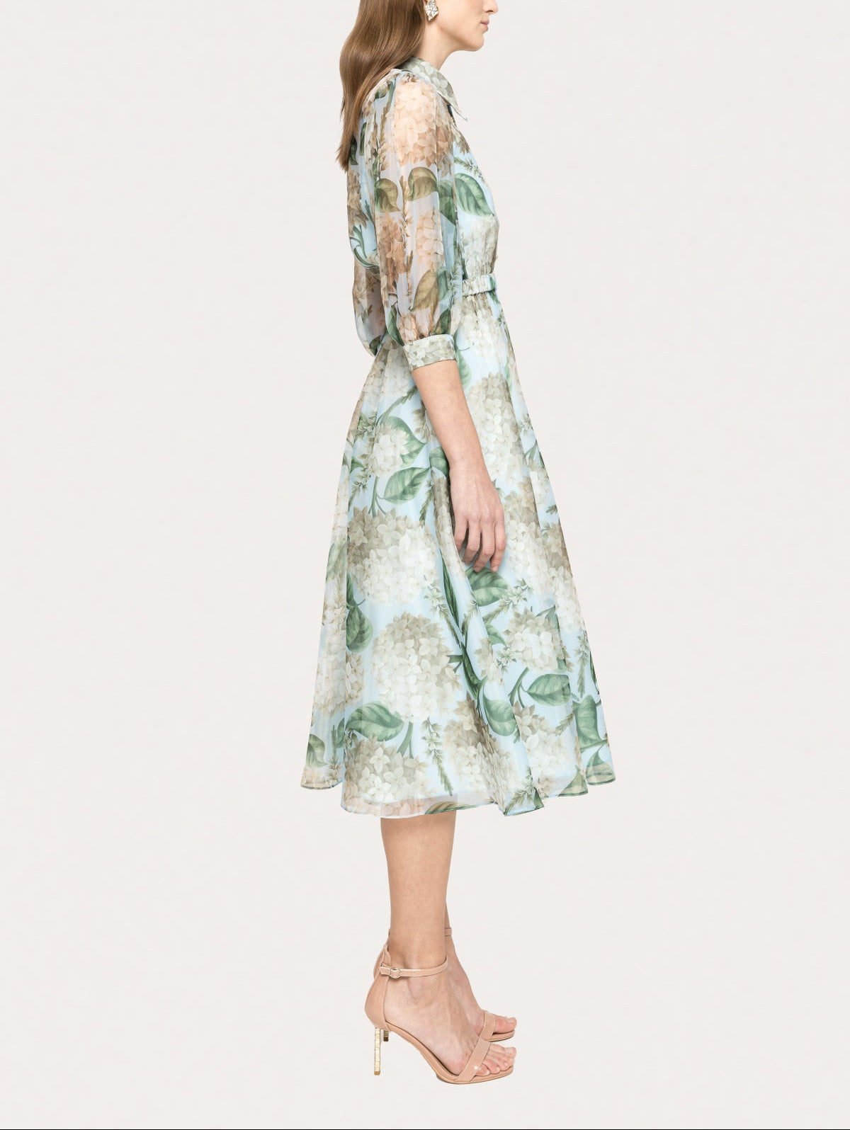 Side profile of floral organza midi dress with sheer 3/4 sleeves and structured collar, lightweight elegant occasion dress