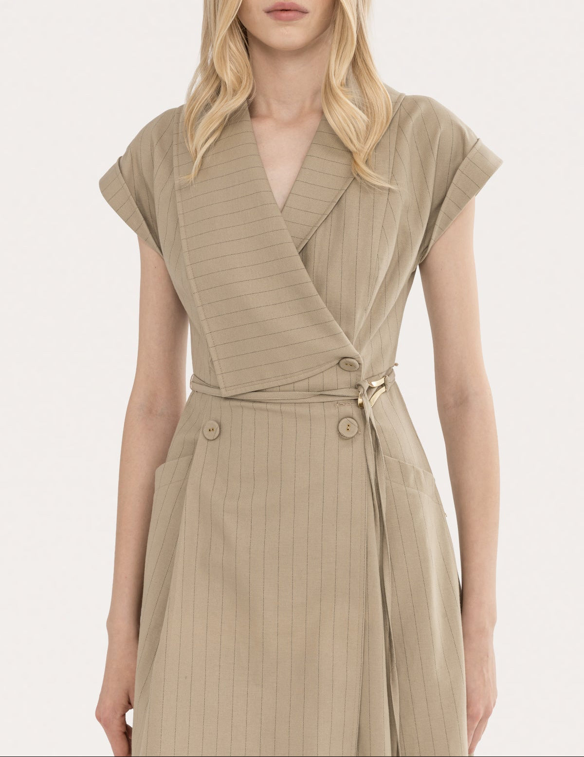 Close-up of beige pinstripe wrap bodice with deep V neckline and cap sleeves