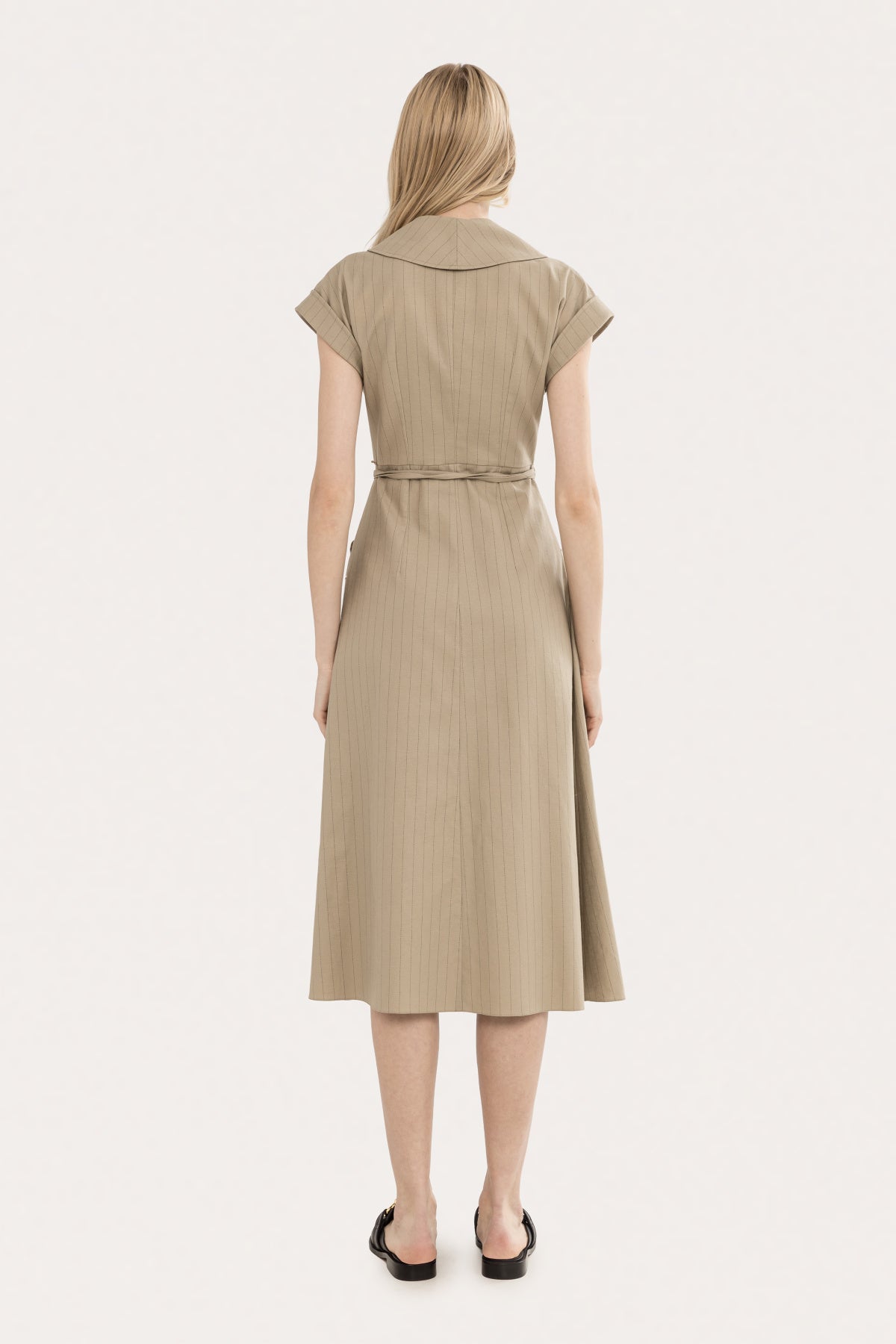 Back view of beige pinstripe cotton-linen midi dress with clean tailored shape