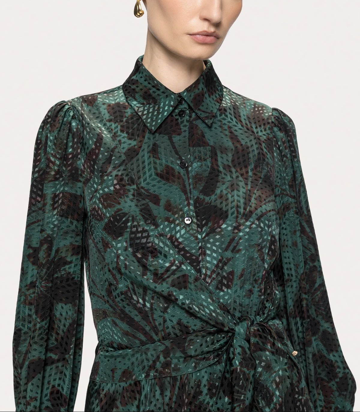 Pointed collar and button-front bodice of NISSA dark green floral midi shirt dress.