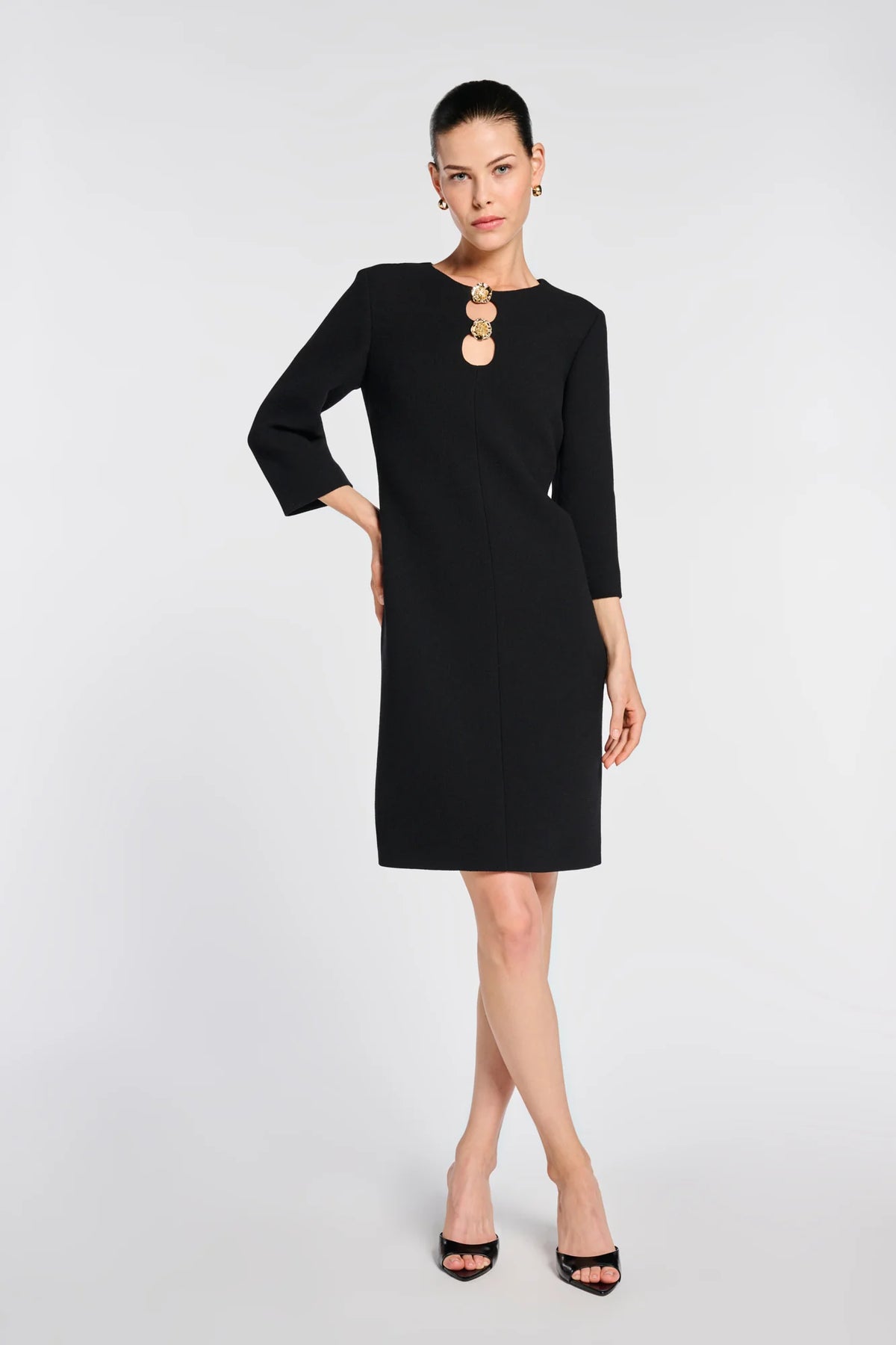 Weill Paris black wool crepe shift dress with gold floral buttons, double-keyhole neckline and three-quarter sleeves.