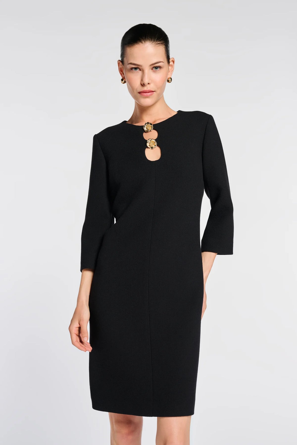 Front view of Weill black shift dress showing the straight silhouette, three-quarter sleeves and above-knee hem.
