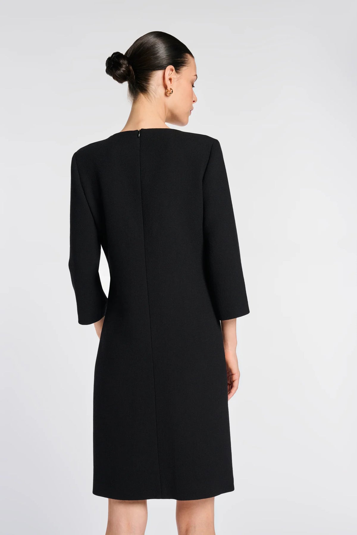 Back view of Weill black wool crepe dress showing the concealed center-back zipper and three-quarter sleeves.