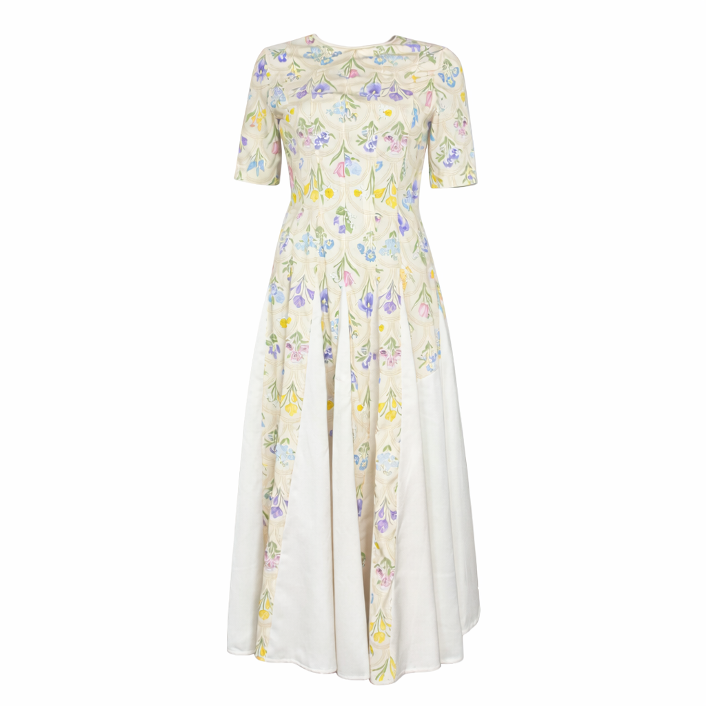 Paneled skirt detail on yellow floral fit and flare midi dress.