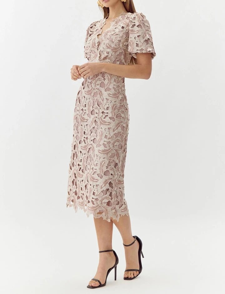 Side view of blush beige lace midi dress with puff sleeves