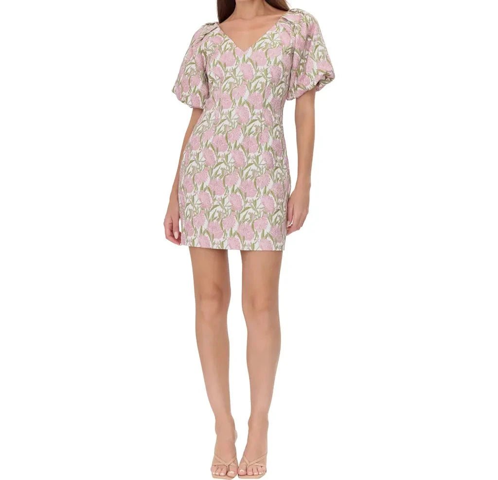 Model in puff sleeve pink floral jacquard mini dress, ideal for spring brunch and daytime events.
