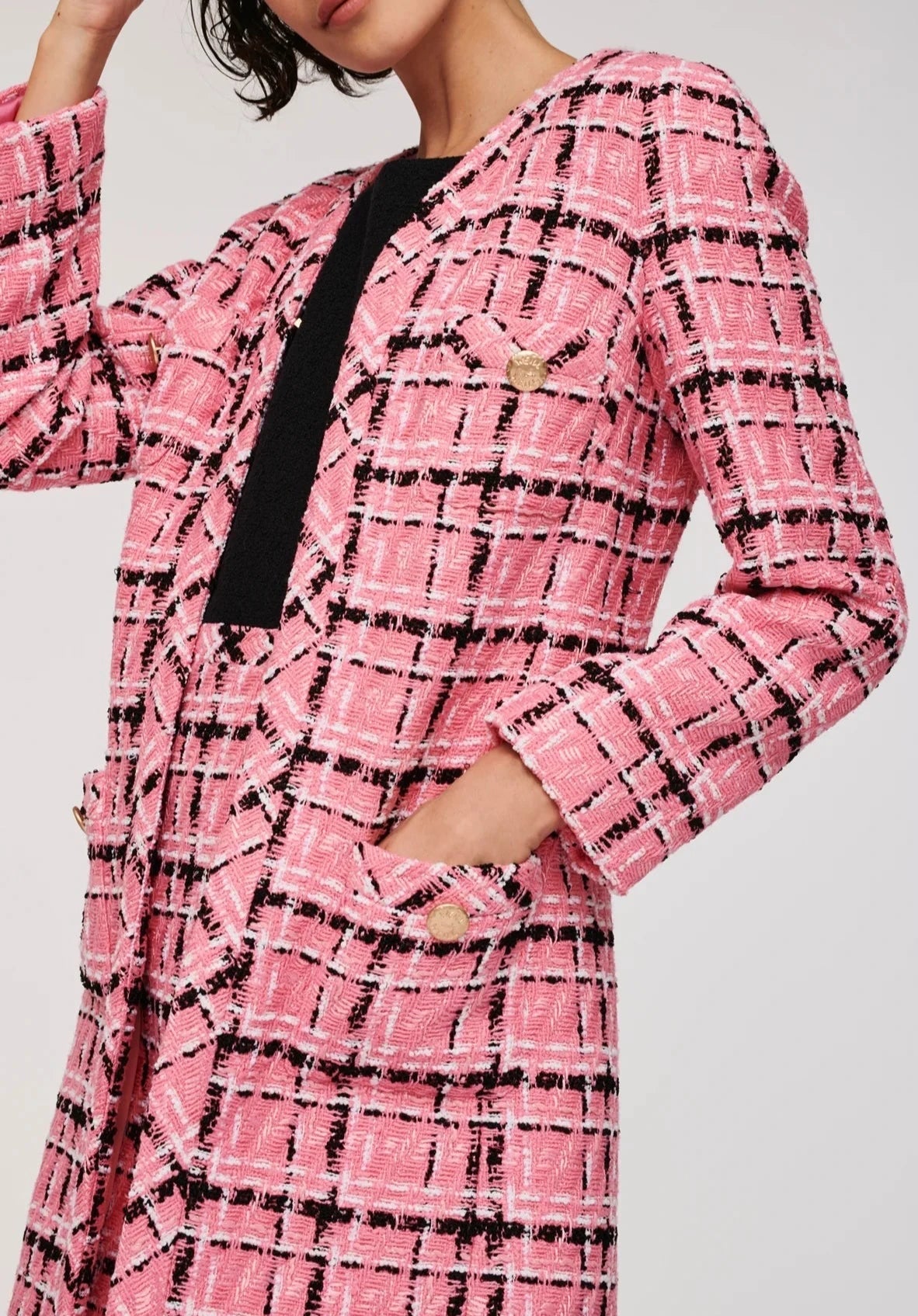 Parisian pink tweed check jacket styled as an elegant statement layer