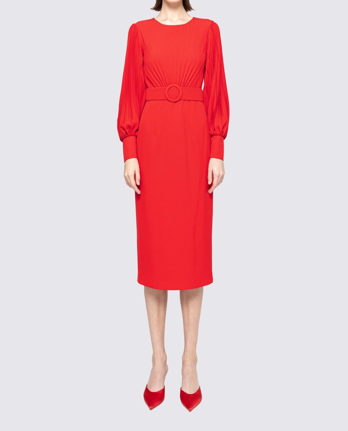 Front view of red belted pencil midi dress with crew neck, pleated long sleeves and fitted below‑knee skirt