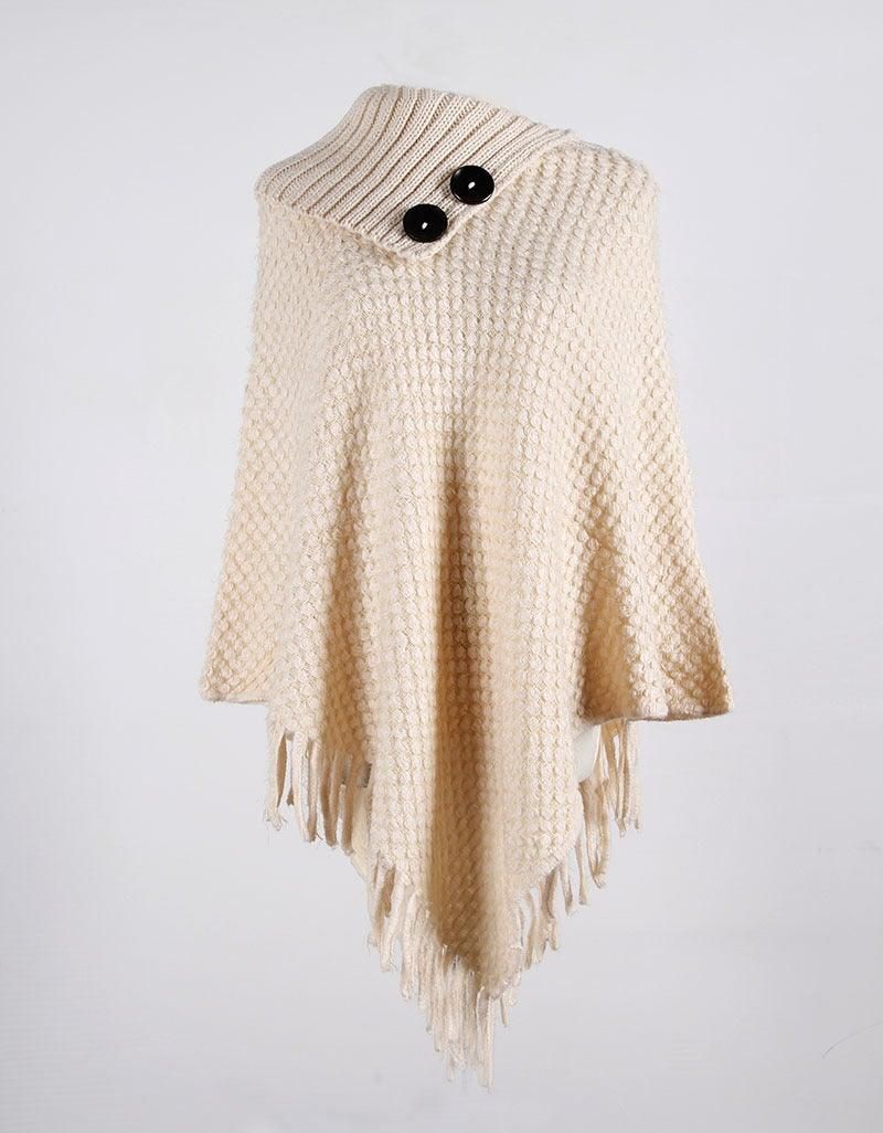 Oversized black button closure on wool poncho