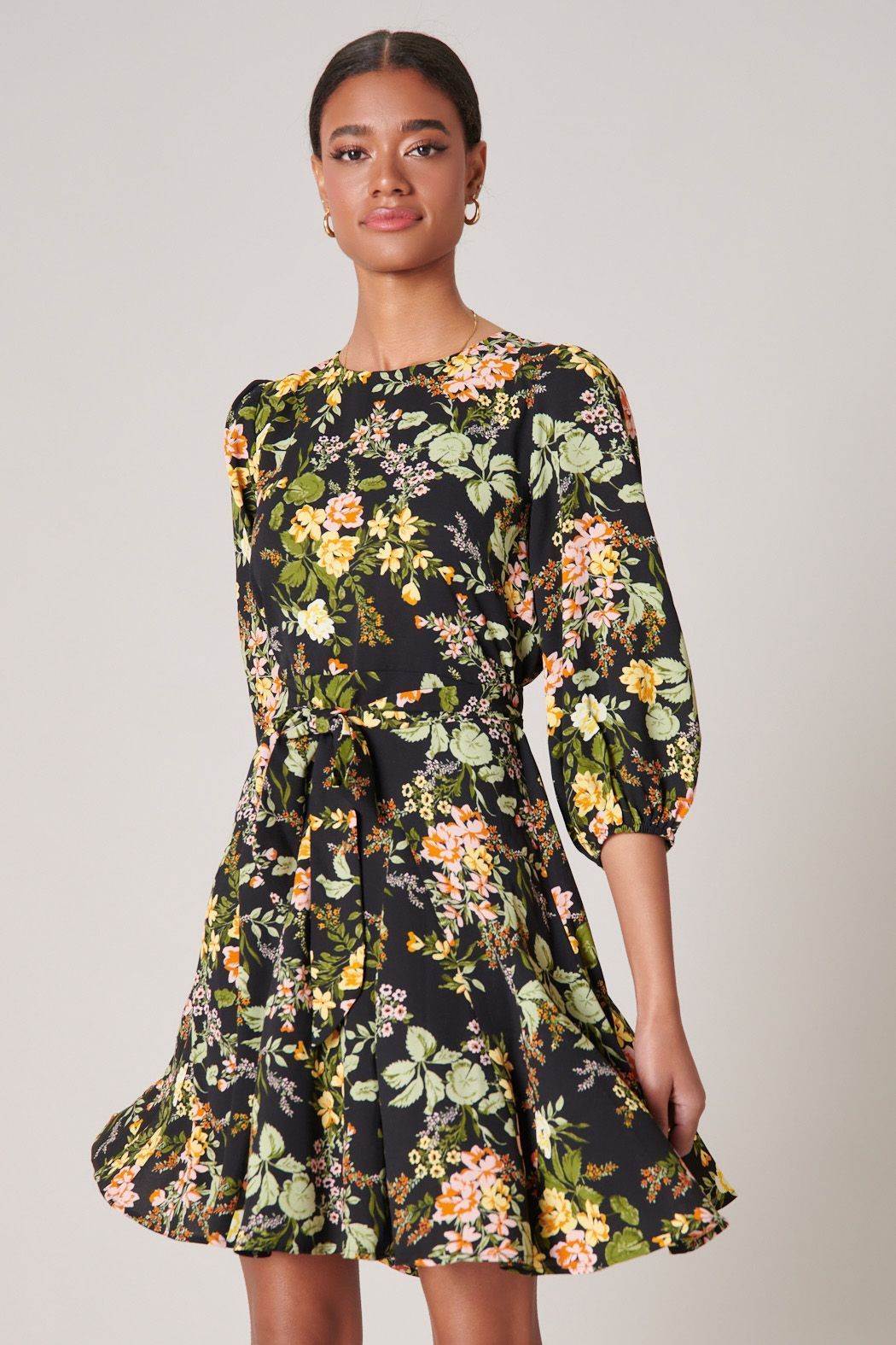 Black floral mini dress with balloon sleeves and flared skirt front view