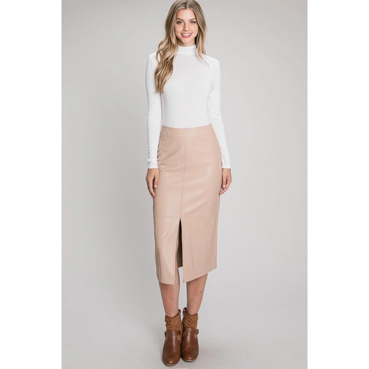 Front view of Allie Rose nude faux leather midi pencil skirt styled with a white turtleneck.