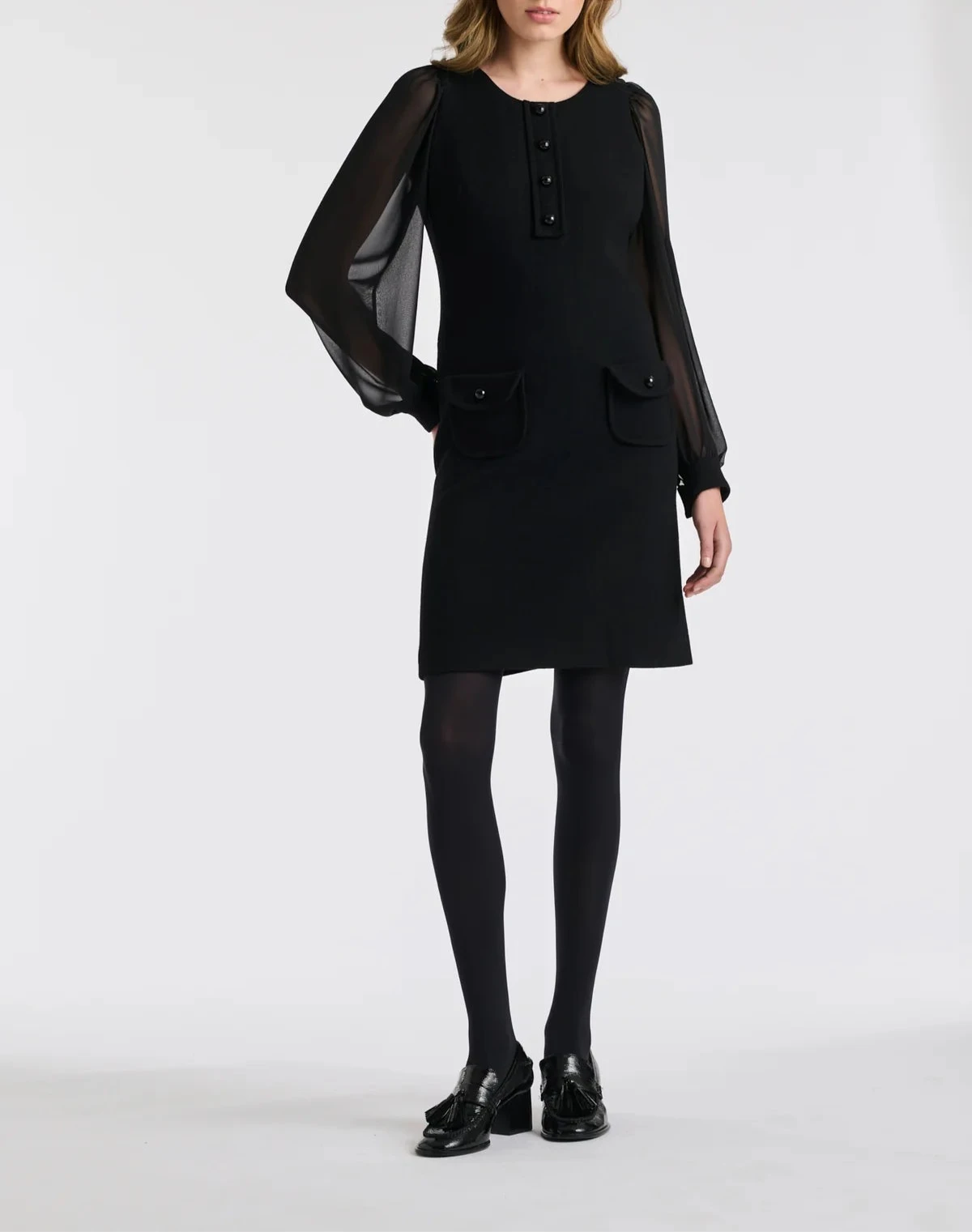 Classic little black dress by Weill Paris with transparent bishop sleeves.
