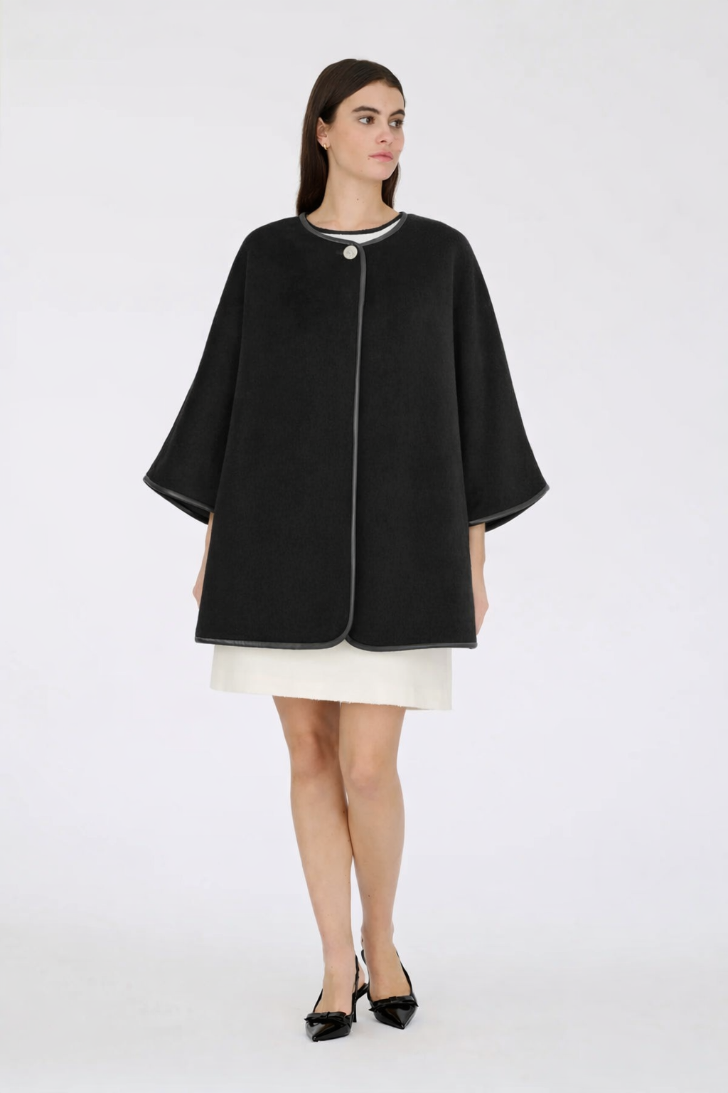 Woman wears black Reversible cape withWeill Paris Short-Sleeved Bouclé Dress with Gold Buttons