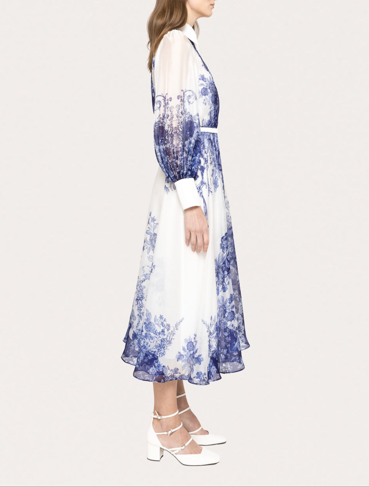 Side view of blue floral organza long sleeve A-line midi dress