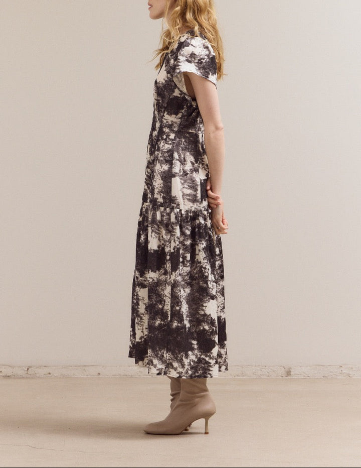 Ivory printed ruffle satin midi dress from Grade & Gather with short sleeves and tiered skirt.