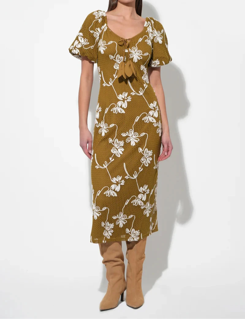 Model wearing Moss Anora Knit Midi Dress by Adelyn Rae with puff sleeves, sweetheart neckline, and white floral embroidery.