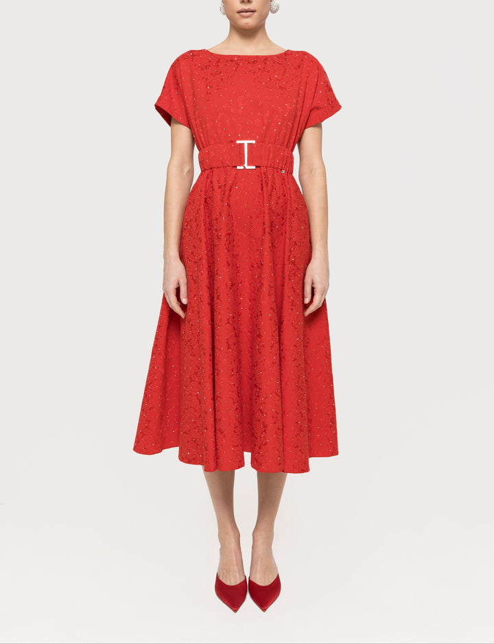 Red rhinestone‑embellished cotton brocade midi dress with boat neckline, short sleeves, belted waist and A‑line skirt.