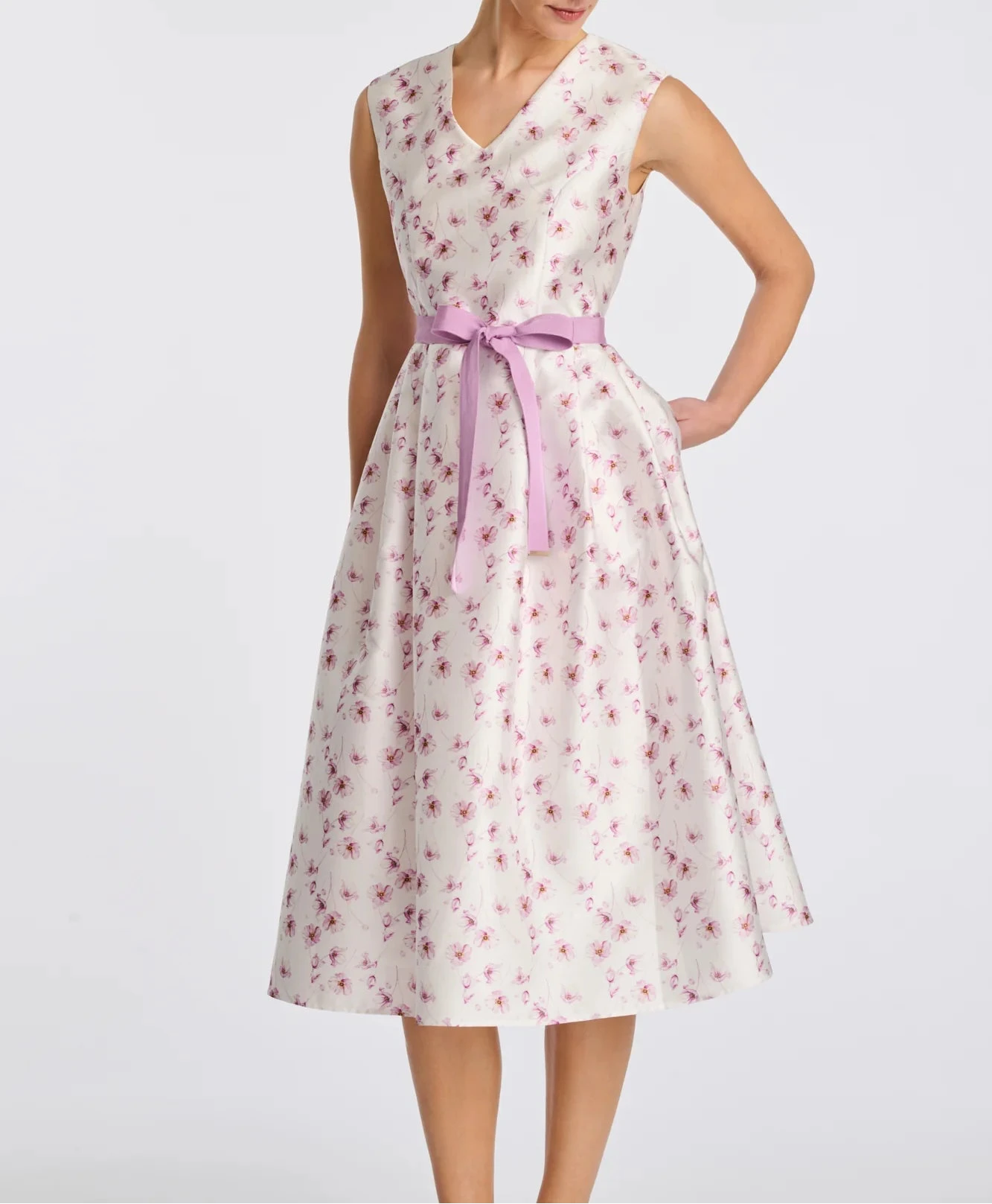 Sleeveless floral taffeta midi dress with lilac waist belt and full skirt on model