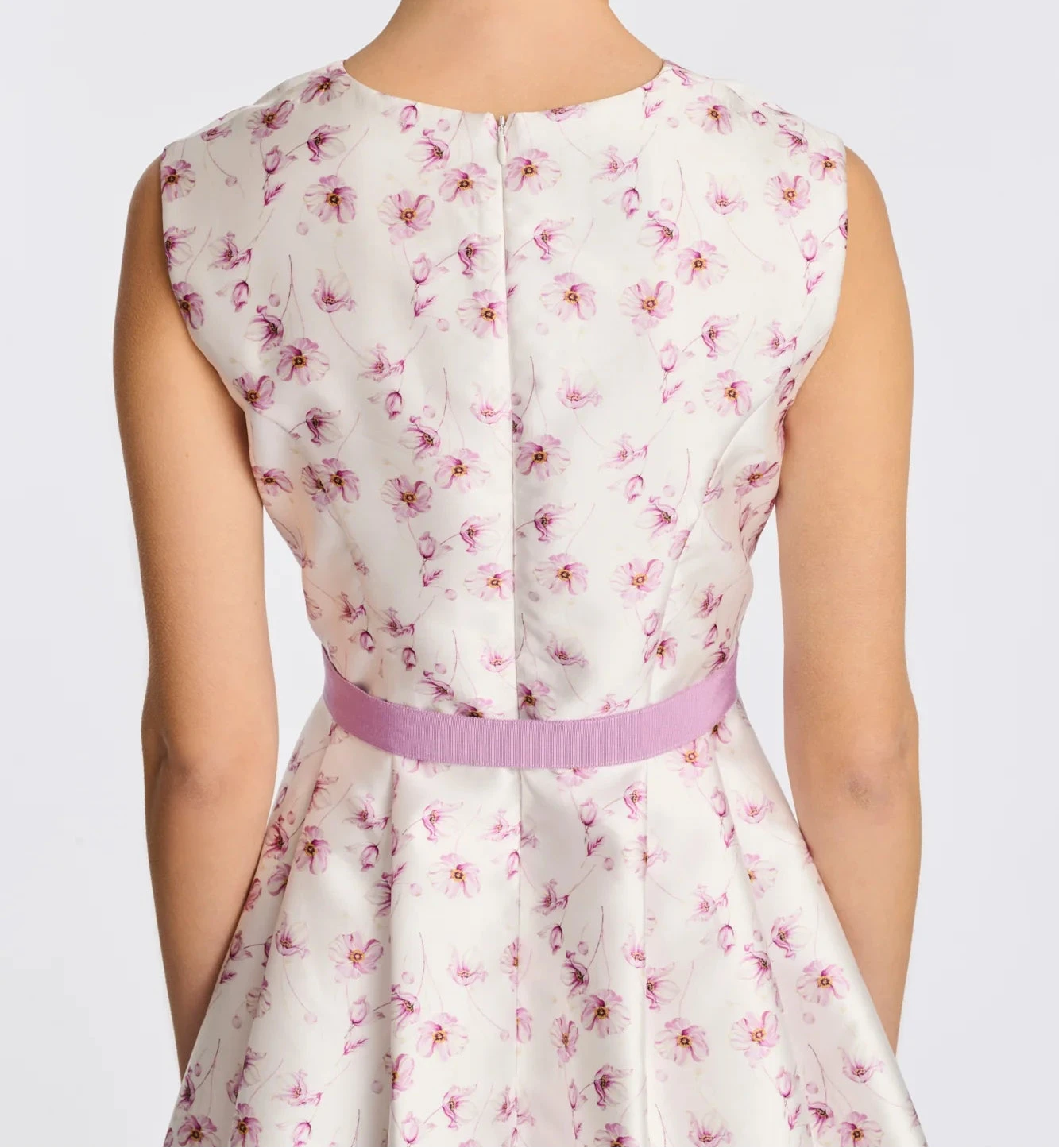 Back view close-up of floral taffeta midi dress with fitted bodice and lilac waist belt