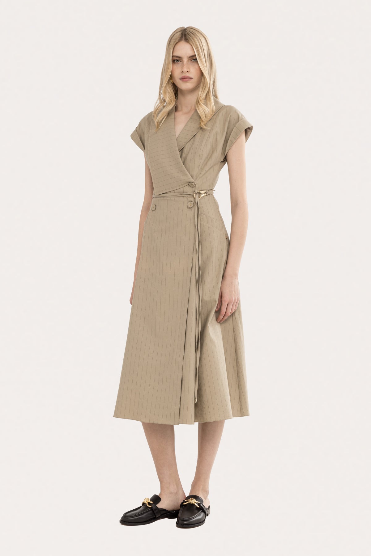 Beige pinstripe wrap midi dress with defined waist and tailored skirt angled view