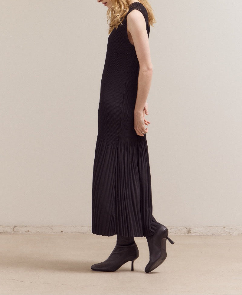 Black maxi dress with vertical accordion pleats and sleeveless design by GRADE & GATHER