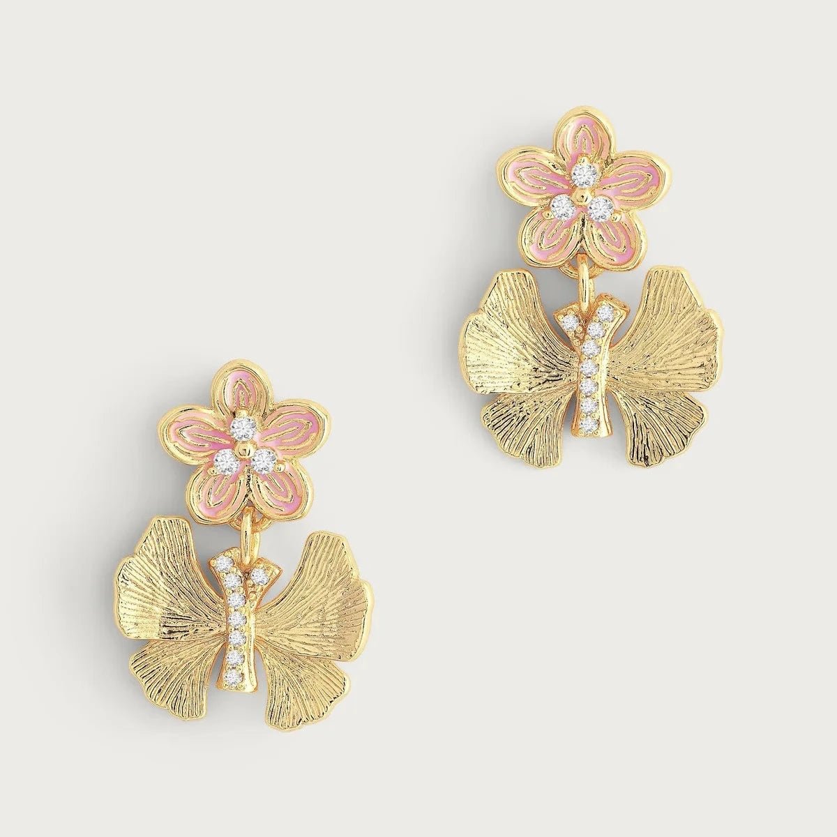 Anabel Aram Butterfly with Enamel Flower Earrings featuring gold‑plated butterflies with pink enamel flowers and sparkling crystals.