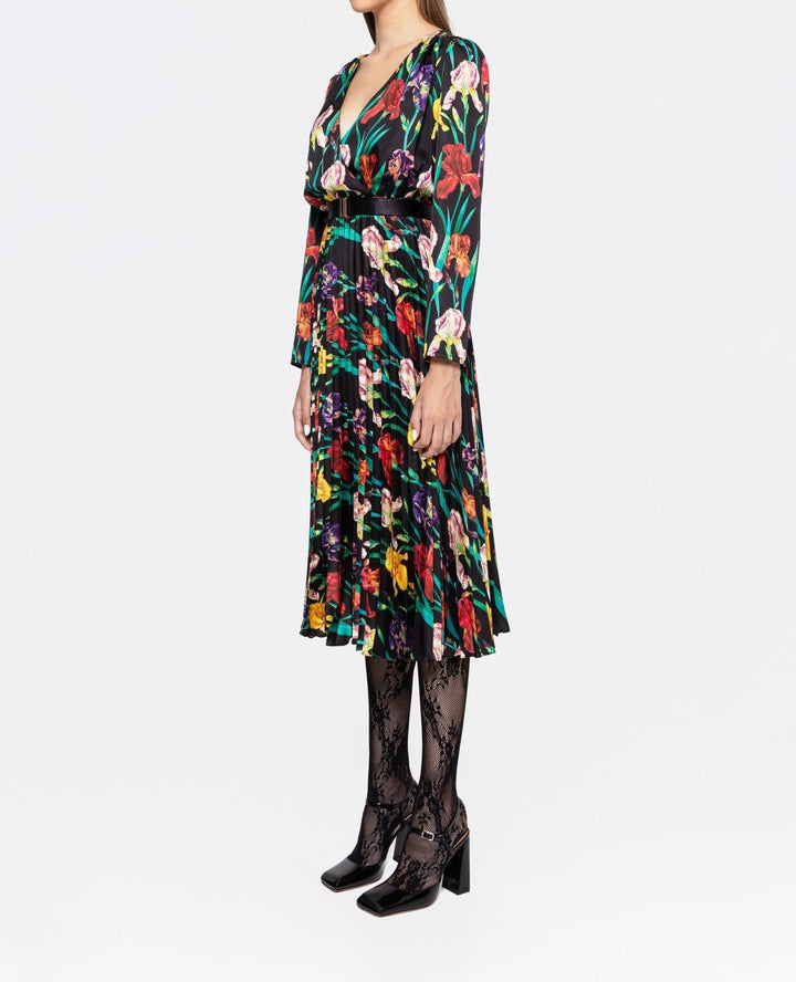 Side view of multicolor iris floral pleated midi dress featuring deep V wrap bodice and long sleeves