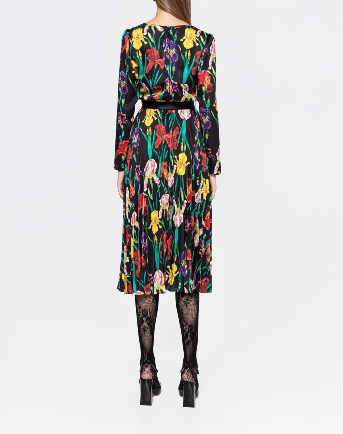 Back view of iris floral pleated midi dress with long sleeves and belt on black background