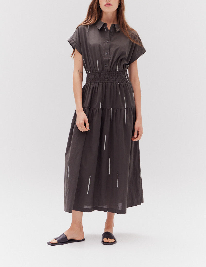 Front view of a woman wearing Grade & Gather Kombu Cotton Print Shirt Dress with cap sleeves and tiered skirt