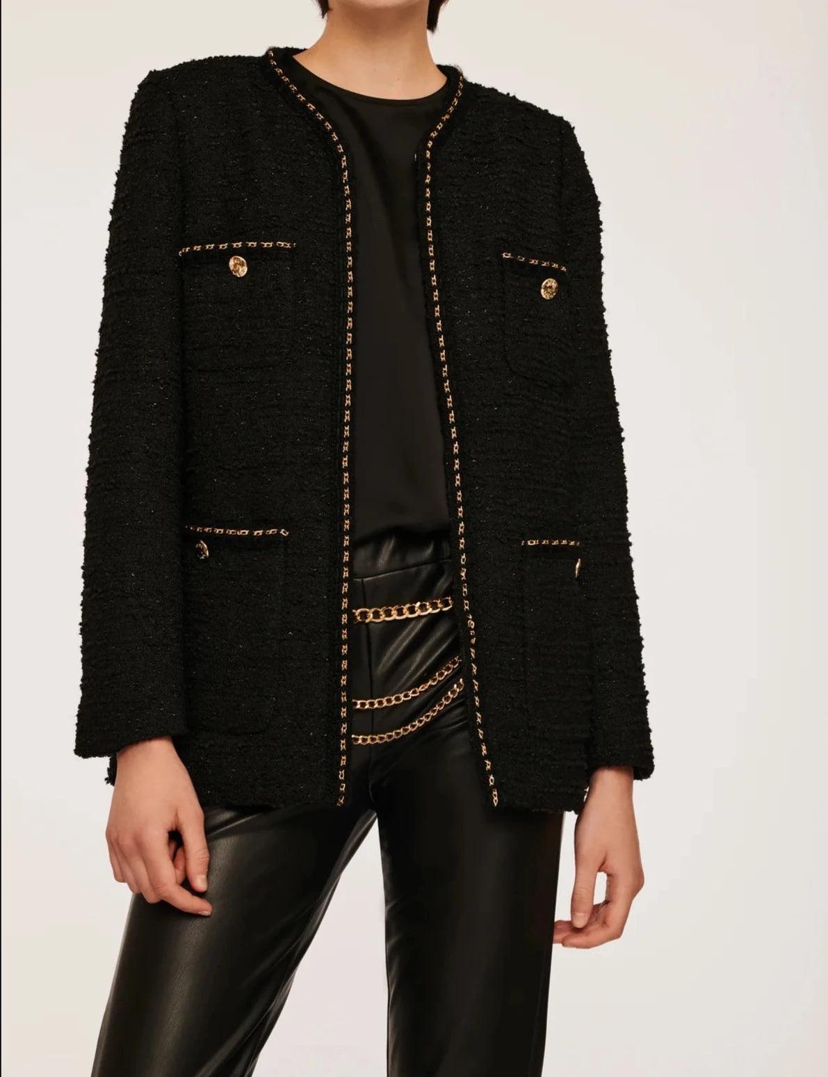 Black tweed jacket with gold chain trim and tailored silhouette by Weill Paris