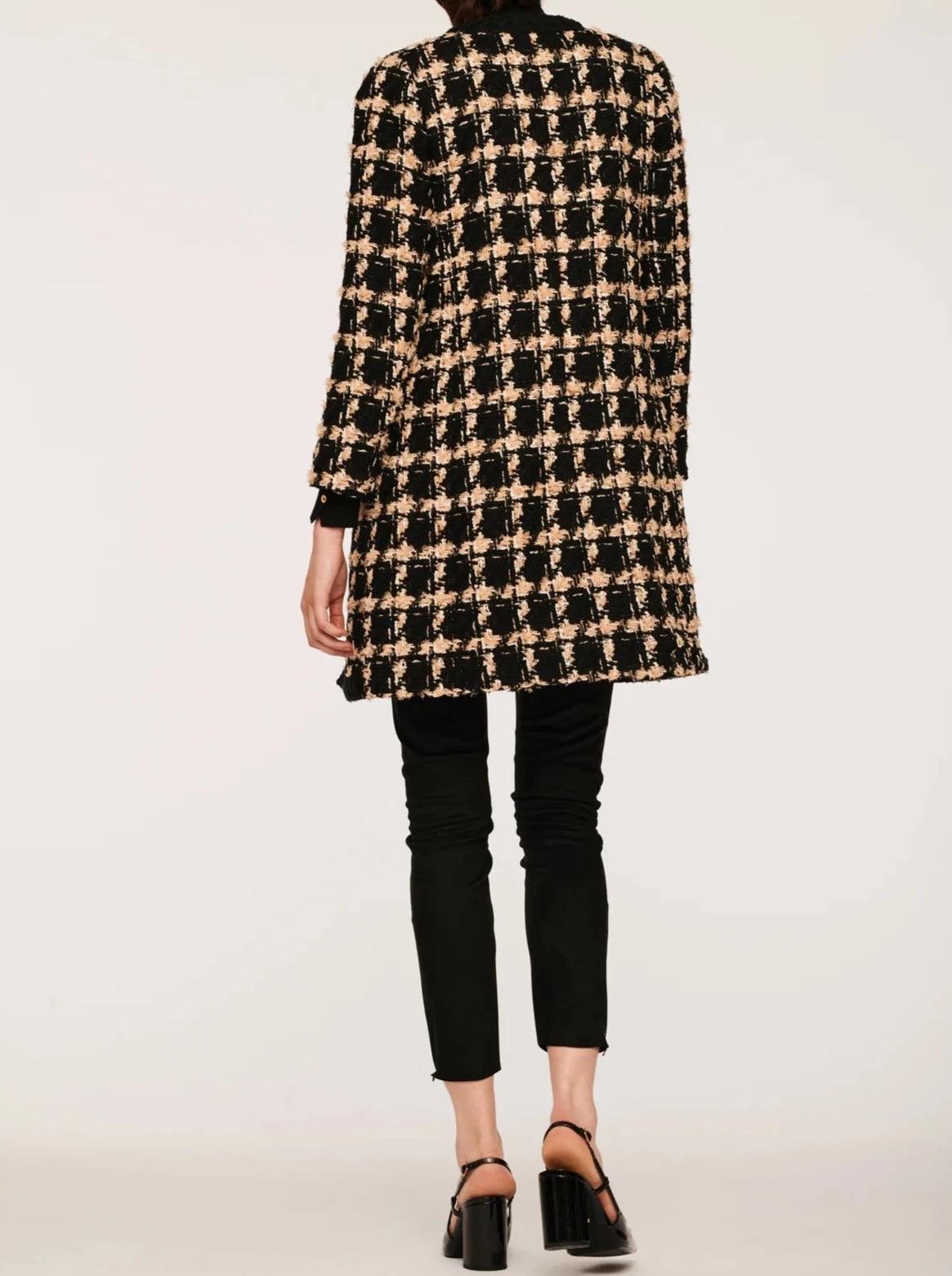 Elegant long tweed jacket with textured fabric and refined detailing