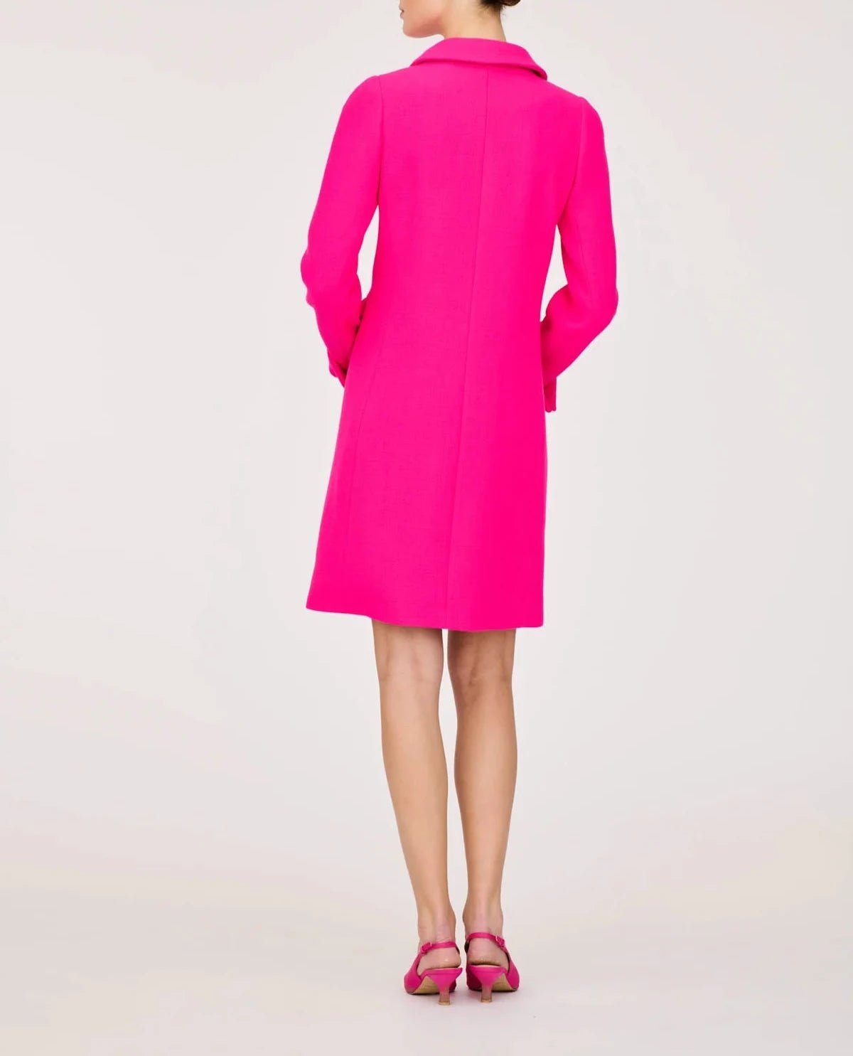 Back view of the Weill Paris hot pink longline jacket with center seam, shaping seams and gently flared hem.
