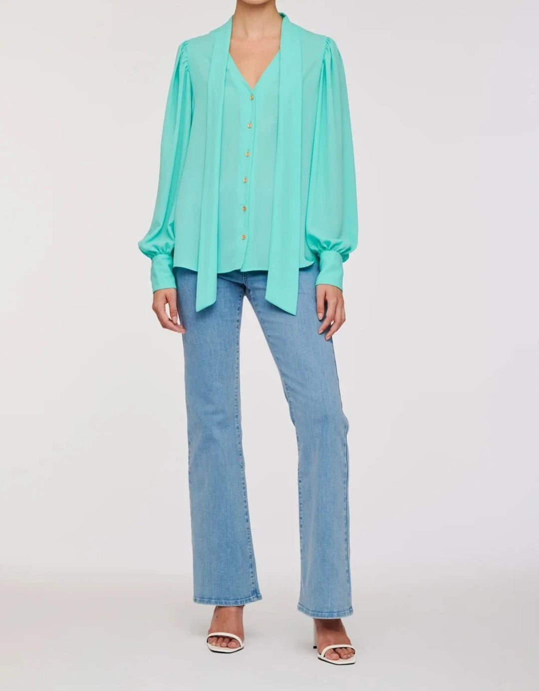 Turquoise pussy bow blouse with long sleeves and gold buttons by Weill Paris