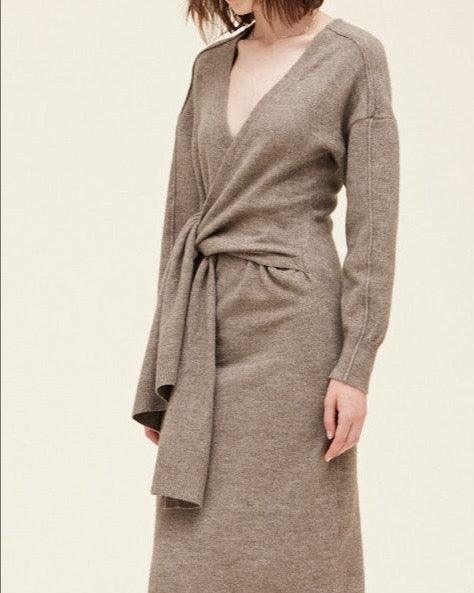 Close-up of side tie detail on field grey knit sweater dress with soft stretch fabric