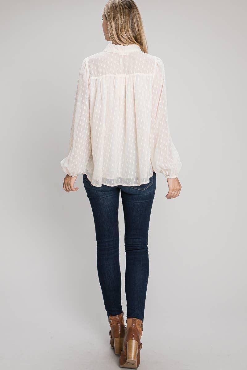 Back of the Champagne Allie Rose blouse showing a sheer upper panel, gathered yoke and long sleeves.