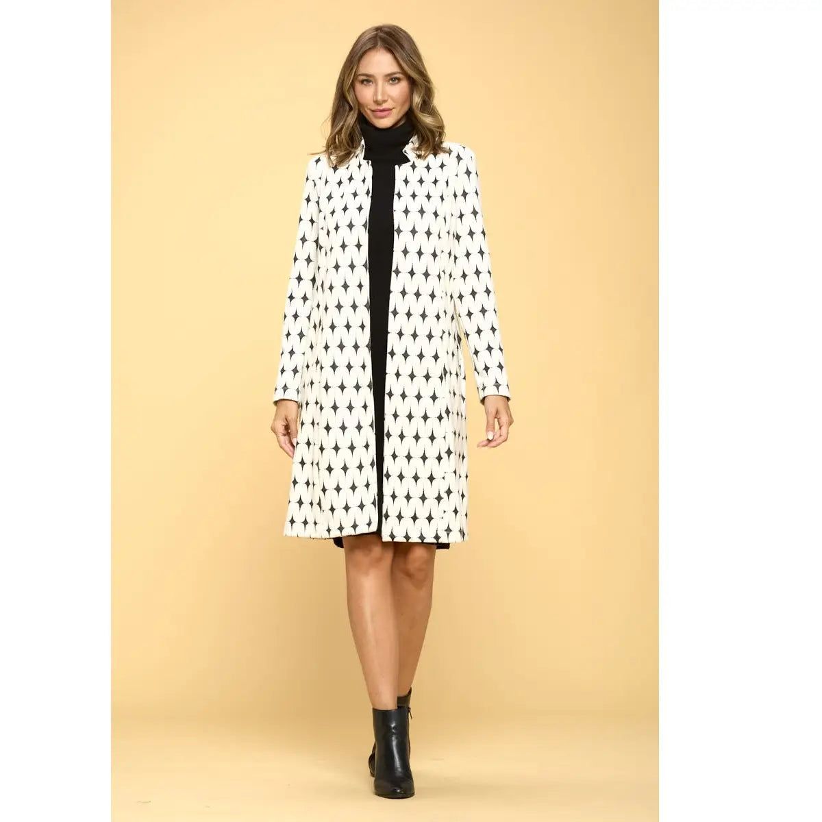 Renee C ivory and black oval-pattern jacket shown from the front, with an open front and near-knee hem.