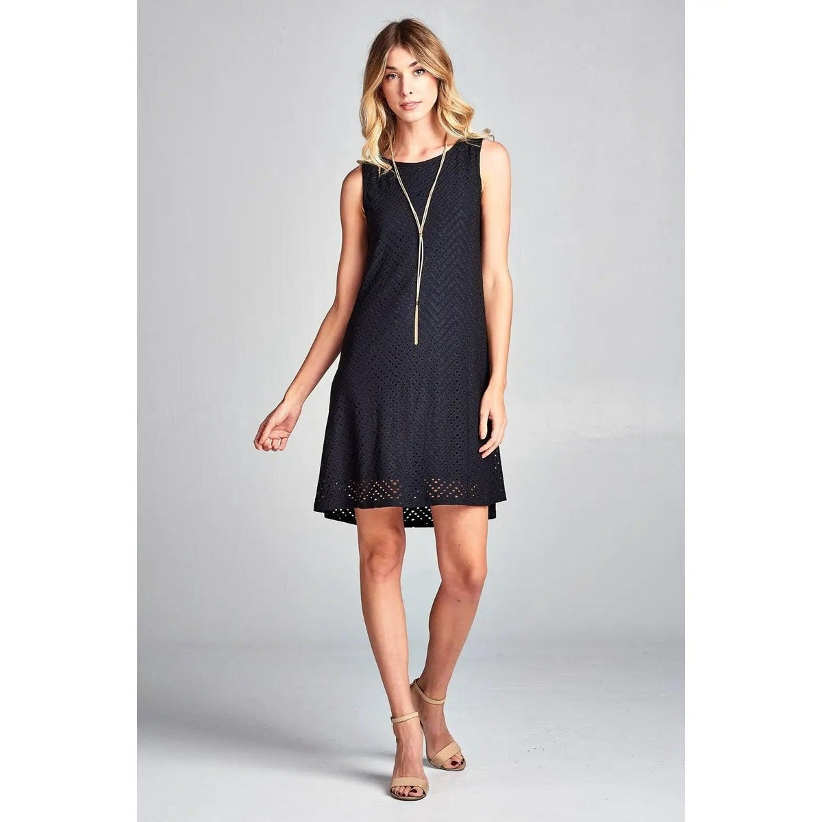 Front view of Renee C black sleeveless eyelet mini dress with a round neckline.