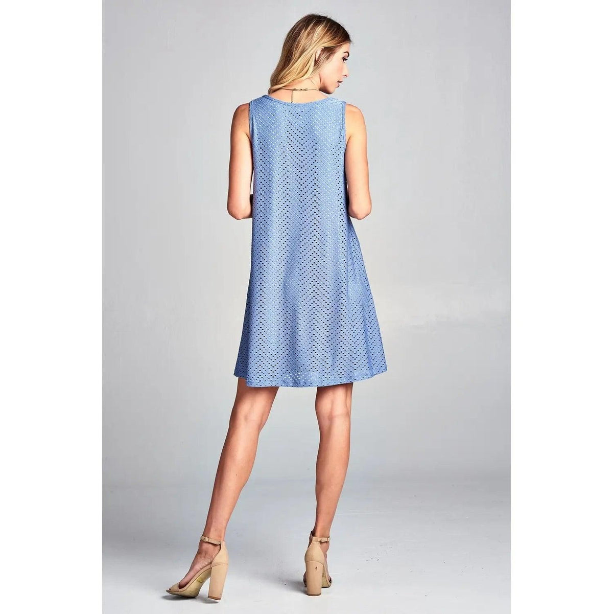Back view of Renee C blue sleeveless mini dress with chevron eyelet texture.