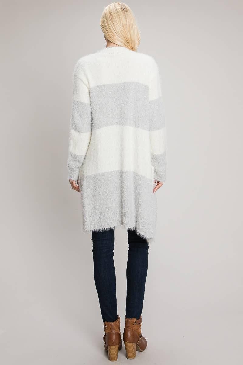 Back view of the longline eyelash cardigan with alternating Heather Grey and ivory color blocks.