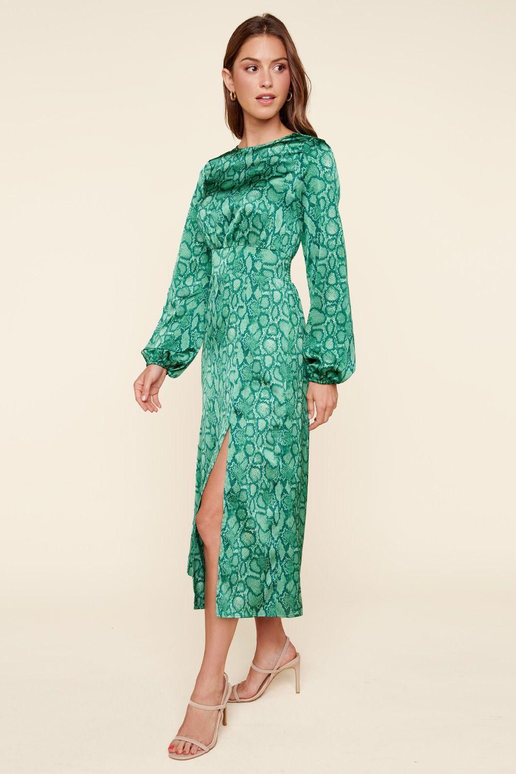 Side view of green print midi dress with slim silhouette and front slit