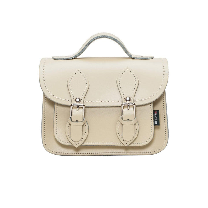 Cream leather satchel handbag with structured shape and dual buckle closure