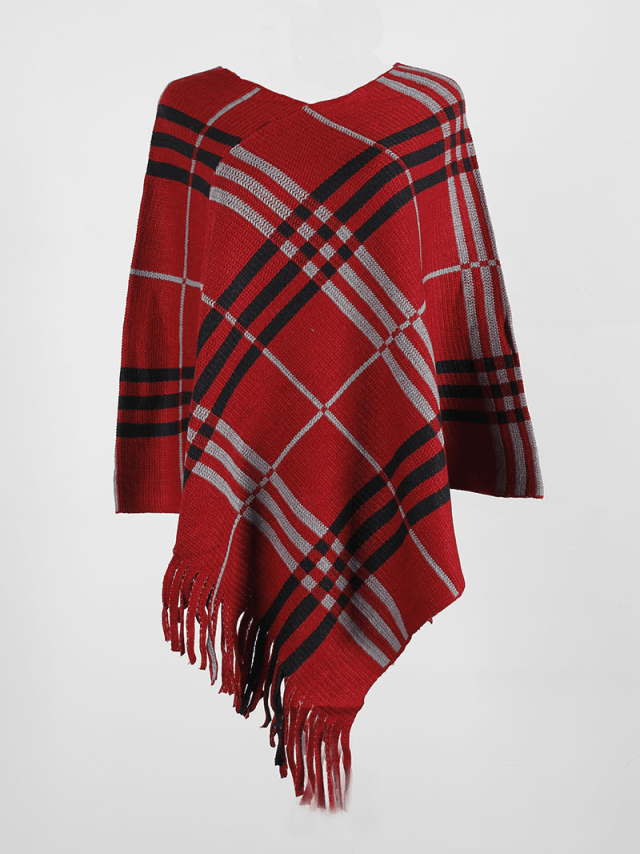 Red plaid knit poncho with fringe and asymmetrical hem