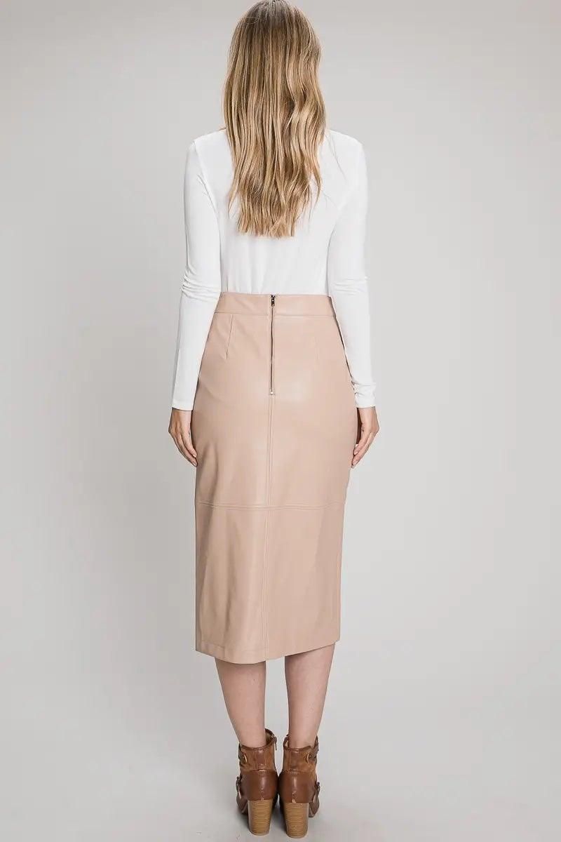 Back view of nude faux leather midi skirt showing an exposed zipper and stitched panels.